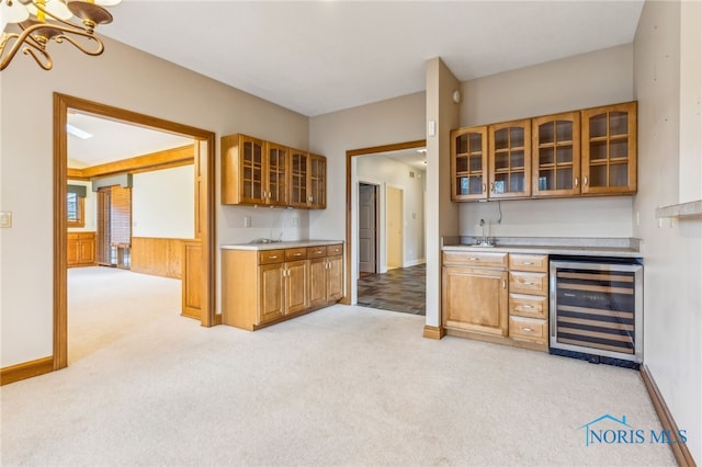 kitchen with light carpet and beverage cooler