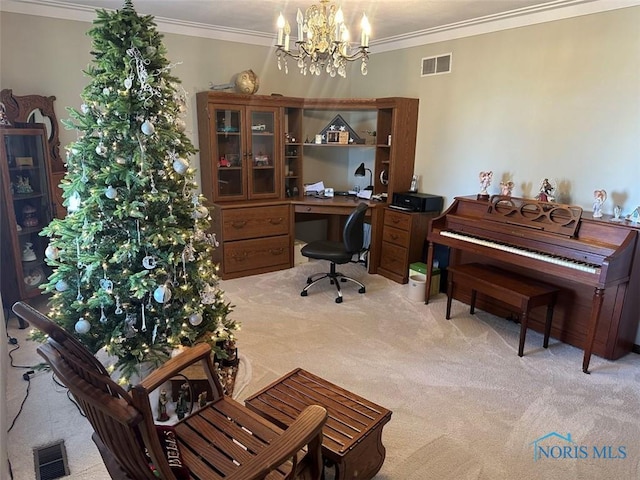 home office with a notable chandelier, ornamental molding, and light colored carpet