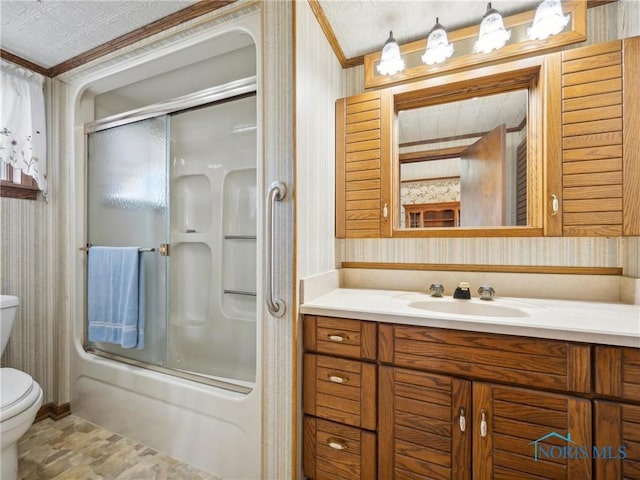 full bathroom with shower / bath combination with glass door, vanity, toilet, and crown molding