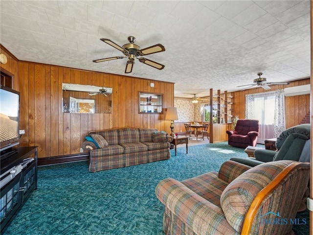 living room featuring dark colored carpet, a textured ceiling, baseboard heating, and wooden walls