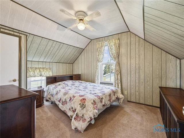 bedroom with ceiling fan, light carpet, and multiple windows