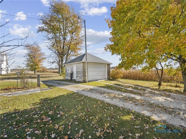 garage with a yard