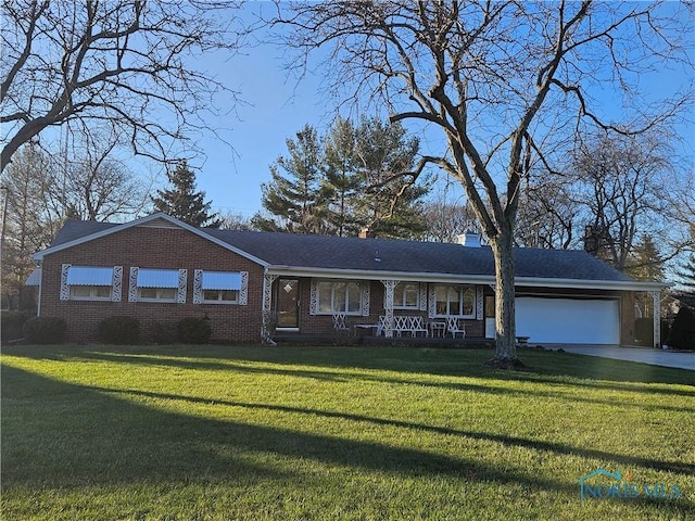 ranch-style house with a porch, a garage, and a front yard