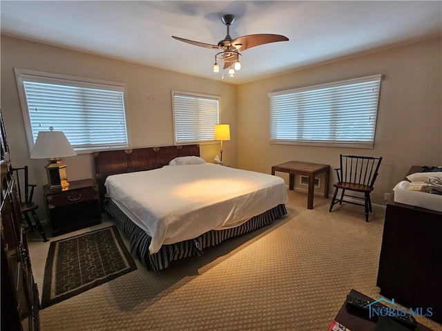 bedroom featuring ceiling fan and carpet floors