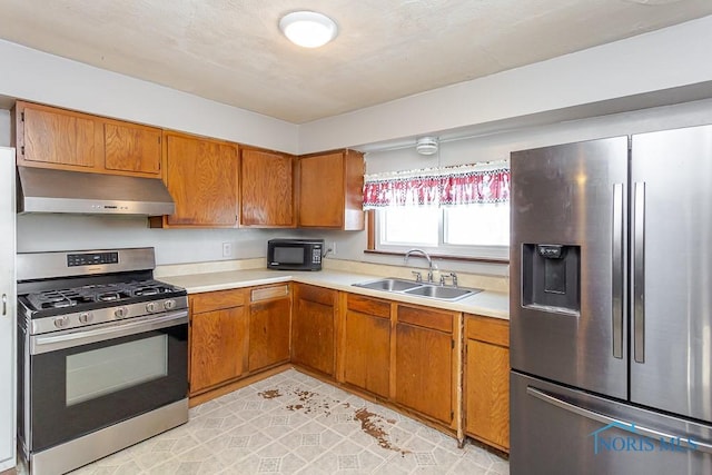 kitchen with light tile patterned floors, sink, and appliances with stainless steel finishes