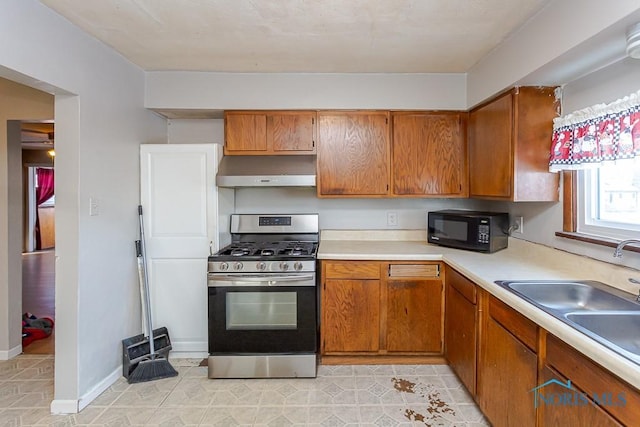 kitchen featuring gas range and sink