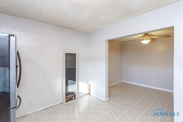 spare room featuring ceiling fan