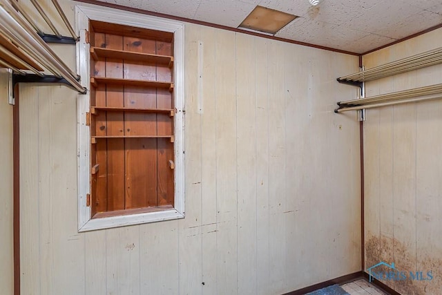 interior space featuring wood walls