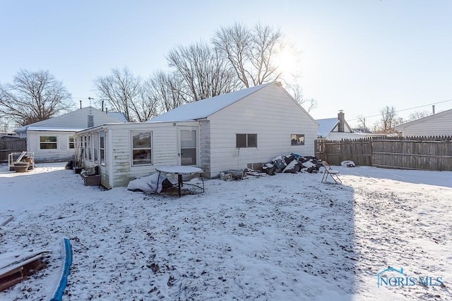 view of snow covered house