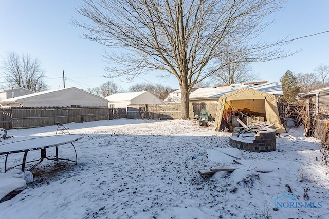 view of yard layered in snow