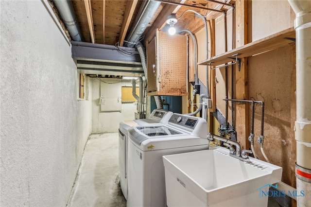 washroom featuring separate washer and dryer and sink