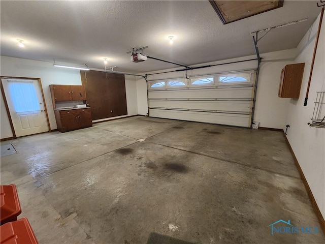 garage featuring a garage door opener