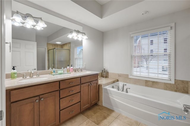 bathroom with separate shower and tub, tile patterned flooring, vanity, and a healthy amount of sunlight