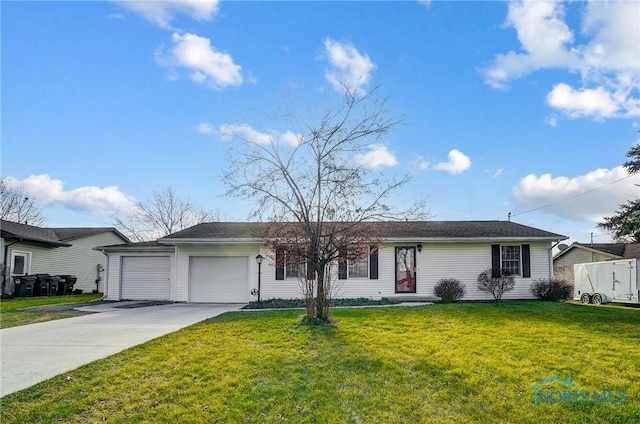 ranch-style home with a garage and a front lawn