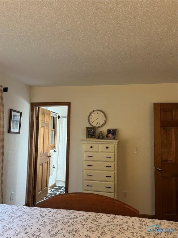 unfurnished bedroom with a textured ceiling