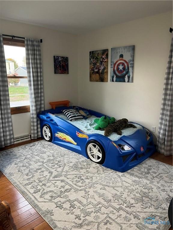 bedroom with hardwood / wood-style floors