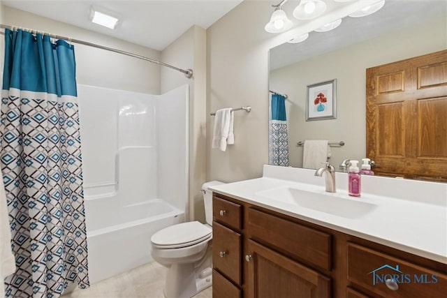 full bathroom featuring vanity, toilet, and shower / tub combo with curtain