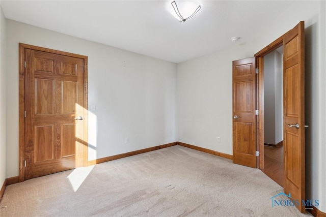 unfurnished bedroom with light carpet