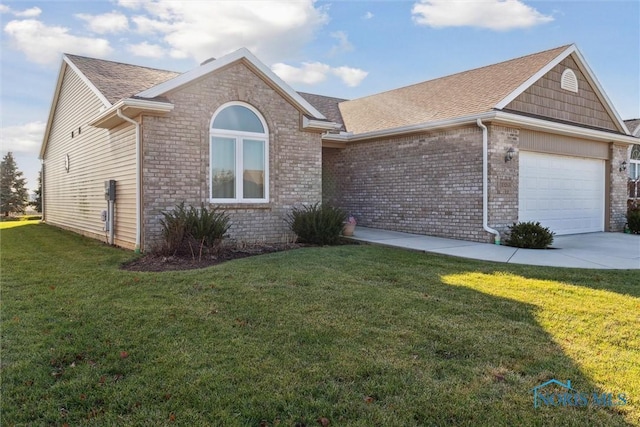 ranch-style house featuring a front yard and a garage