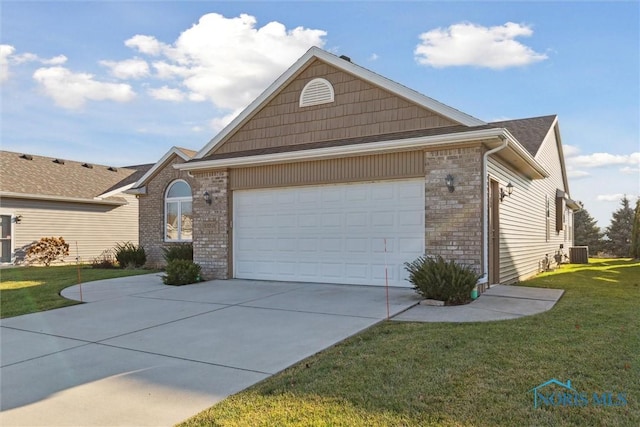 view of front of house featuring cooling unit, a garage, and a front lawn