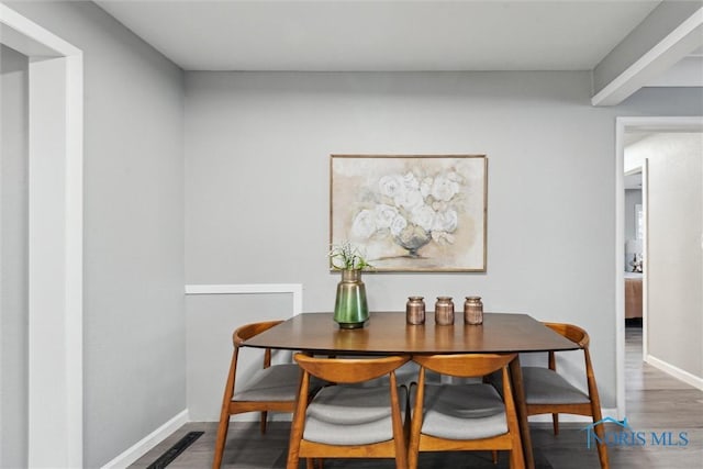 dining room with dark wood-type flooring