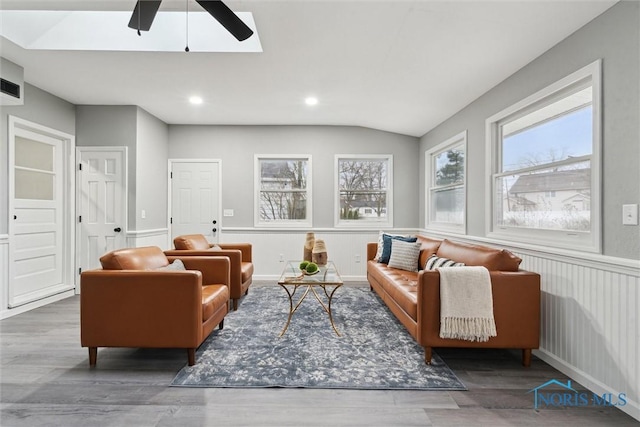 interior space with ceiling fan, dark wood-type flooring, and vaulted ceiling