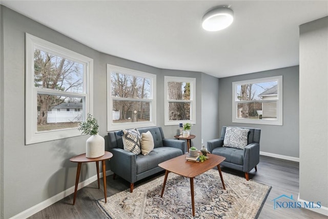 interior space with plenty of natural light and dark hardwood / wood-style floors