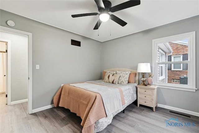 bedroom featuring ceiling fan and light hardwood / wood-style floors