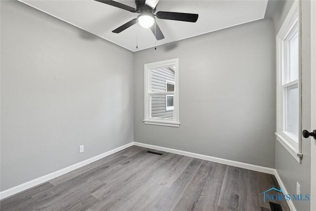 unfurnished room featuring ceiling fan and light wood-type flooring