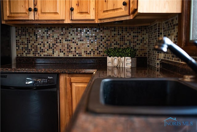 kitchen with tasteful backsplash, dishwasher, and dark stone counters