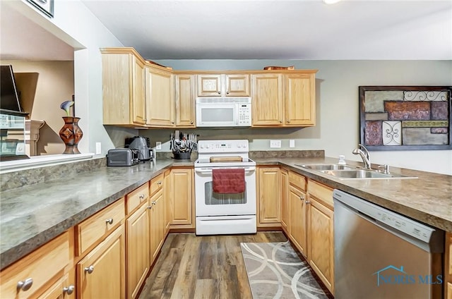 kitchen featuring light brown cabinets, dark hardwood / wood-style flooring, white appliances, and sink