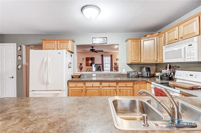 kitchen featuring light brown cabinetry, ceiling fan, sink, and white appliances