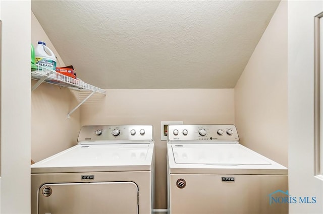 laundry area with separate washer and dryer