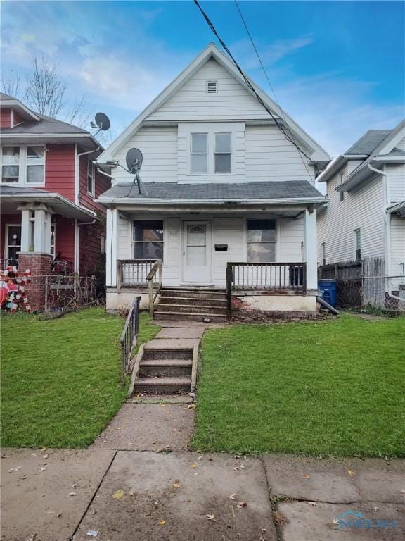 bungalow-style house featuring a porch and a front yard