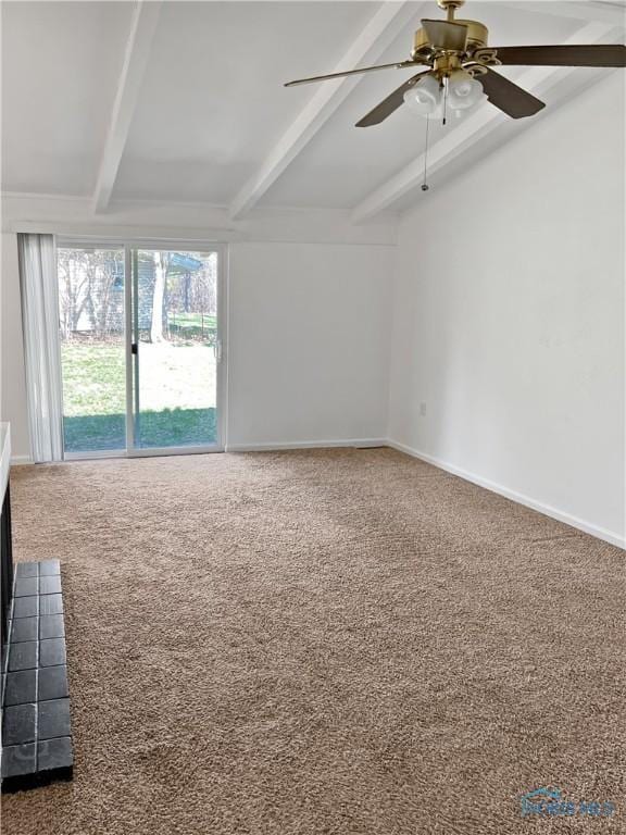 spare room with ceiling fan, beam ceiling, and carpet floors