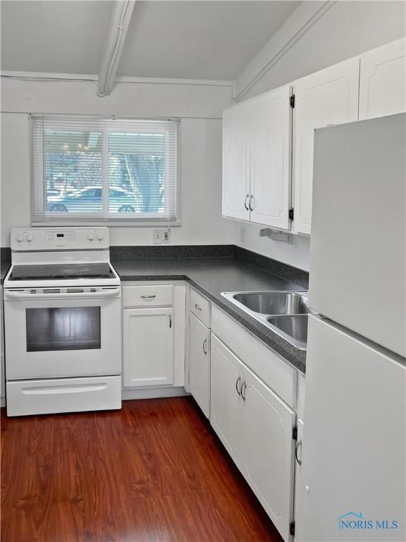 kitchen with beam ceiling, white appliances, dark hardwood / wood-style floors, and white cabinetry