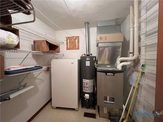 utility room with water heater