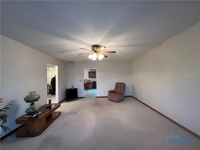 unfurnished room featuring a textured ceiling and ceiling fan