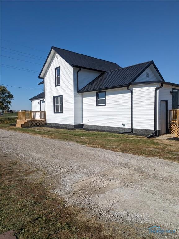 view of home's exterior with a deck