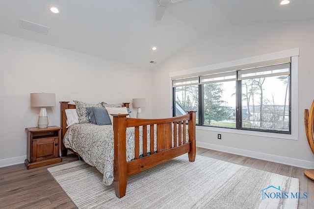 bedroom featuring ceiling fan, hardwood / wood-style floors, and vaulted ceiling