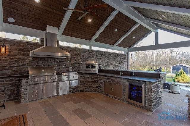 view of patio featuring a gazebo, grilling area, sink, and exterior kitchen