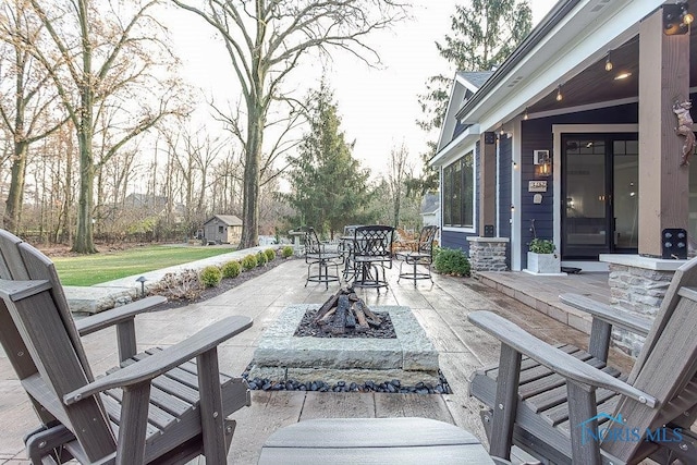 view of patio / terrace with a fire pit