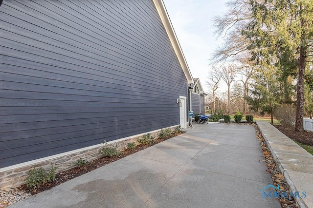 view of property exterior featuring a patio area