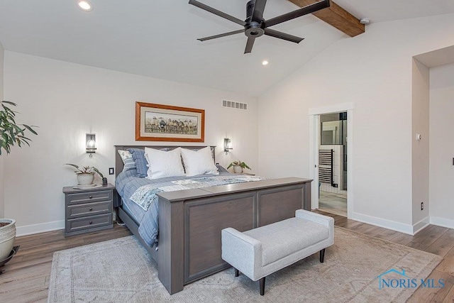 bedroom featuring ceiling fan, lofted ceiling with beams, and light wood-type flooring