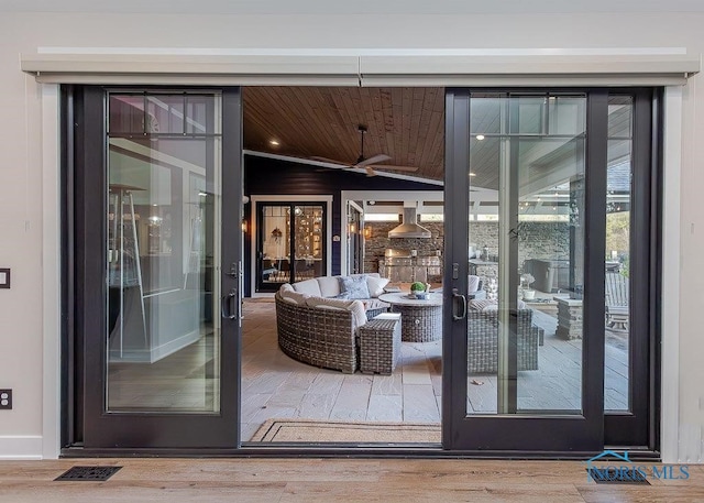 doorway to outside with wooden ceiling, french doors, ceiling fan, and hardwood / wood-style floors