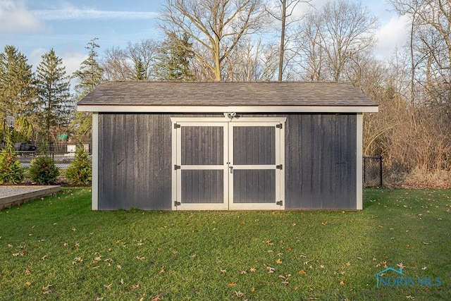 view of outdoor structure with a lawn