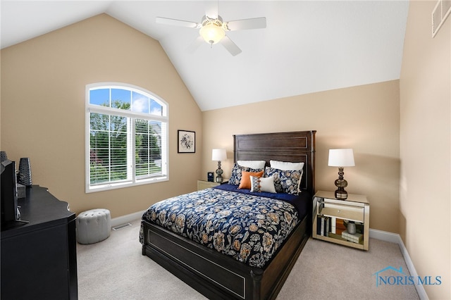 carpeted bedroom featuring ceiling fan and vaulted ceiling