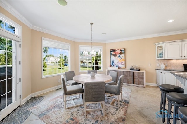 tiled dining space with a notable chandelier and ornamental molding