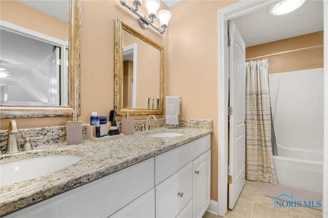 bathroom with vanity, tile patterned floors, ceiling fan, and shower / bath combo with shower curtain