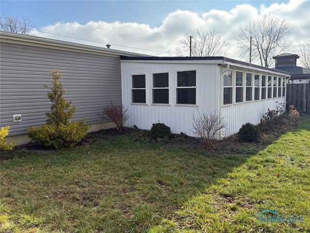 view of property exterior featuring a yard